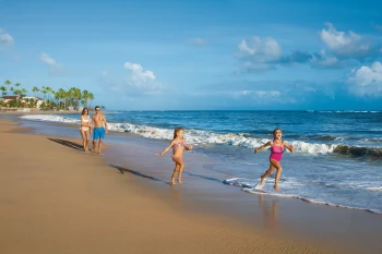 Family on the beach at Dreams Onyx Resort & Spa