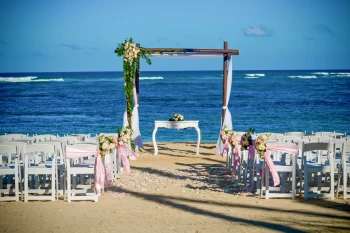 Ceremony decor on the stone beach at Dreams Onyx Resort & Spa