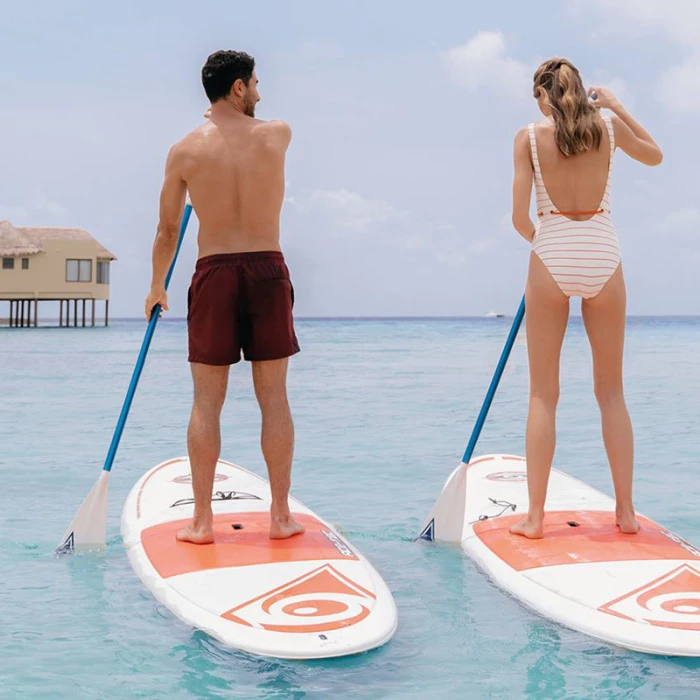 Couple enjoying paddlesurf at El Dorado Maroma