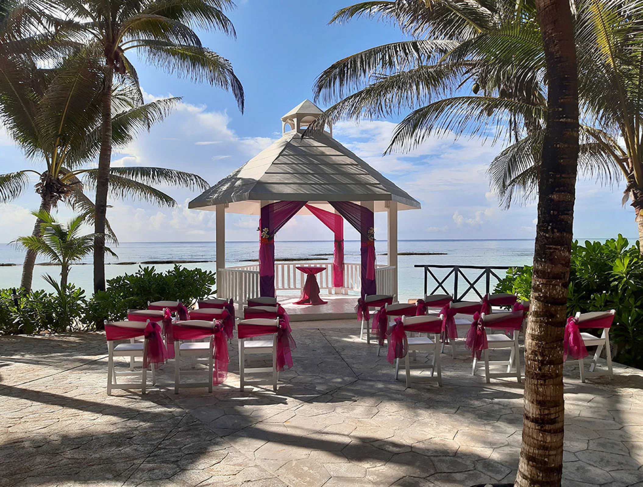 White gazebo wedding venue at El dorado Seaside suites