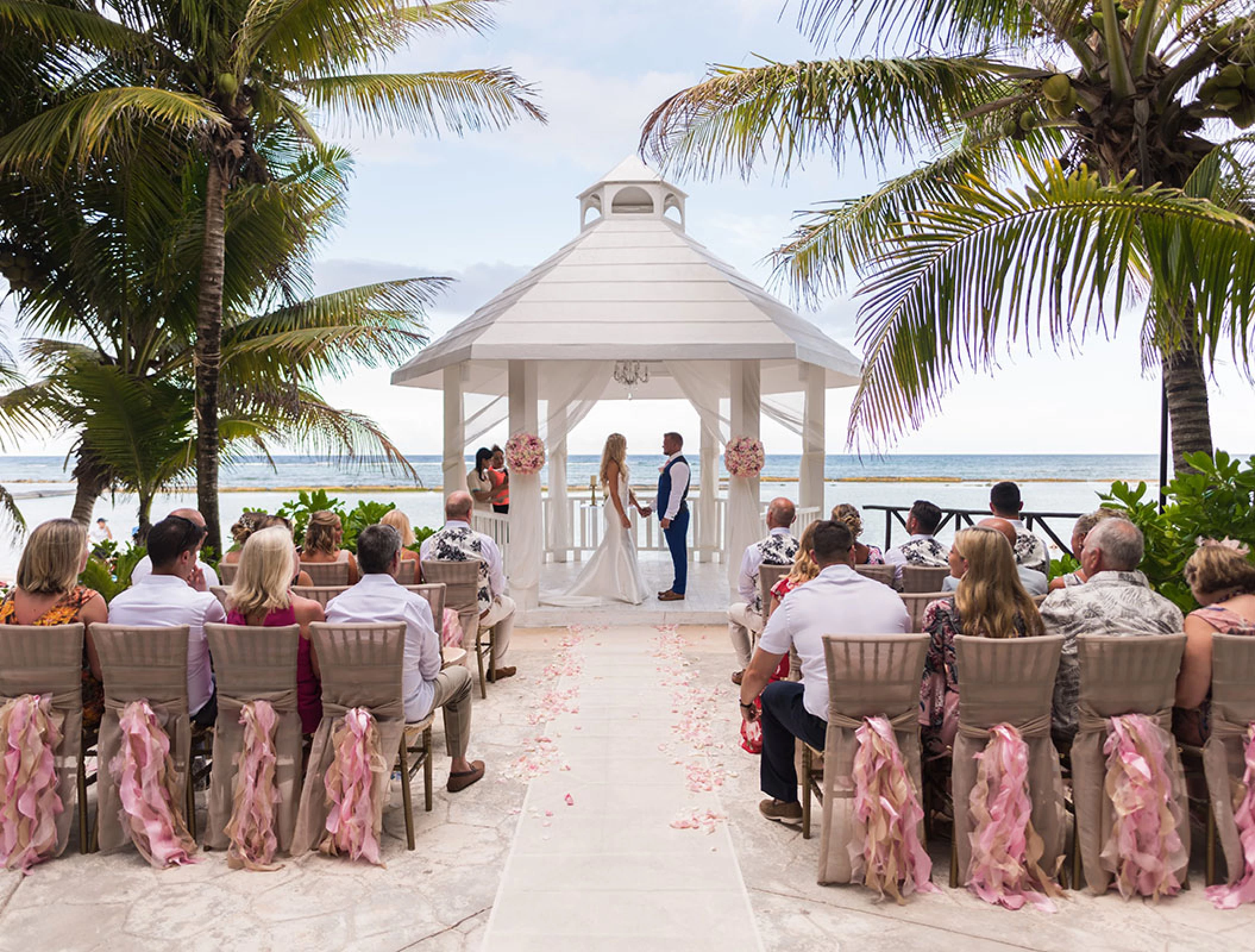 wedding ceremony at white gazebo venue on El dorado Seaside suites