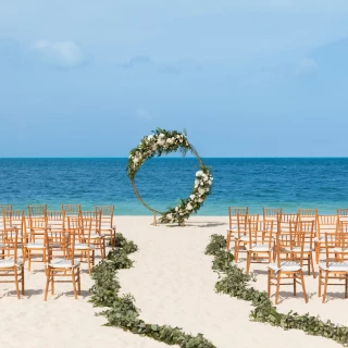 Symbolic ceremony in beach wedding venue at Excellence Playa Mujeres