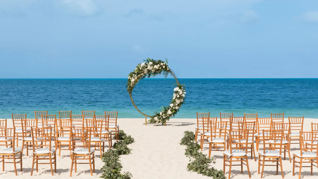 Symbolic ceremony in beach wedding venue at Excellence Playa Mujeres