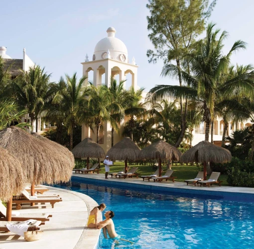 Excellence Riviera Cancun pool with couple