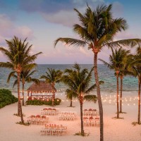 beach wedding reception with seating at Excellence Riviera Cancun