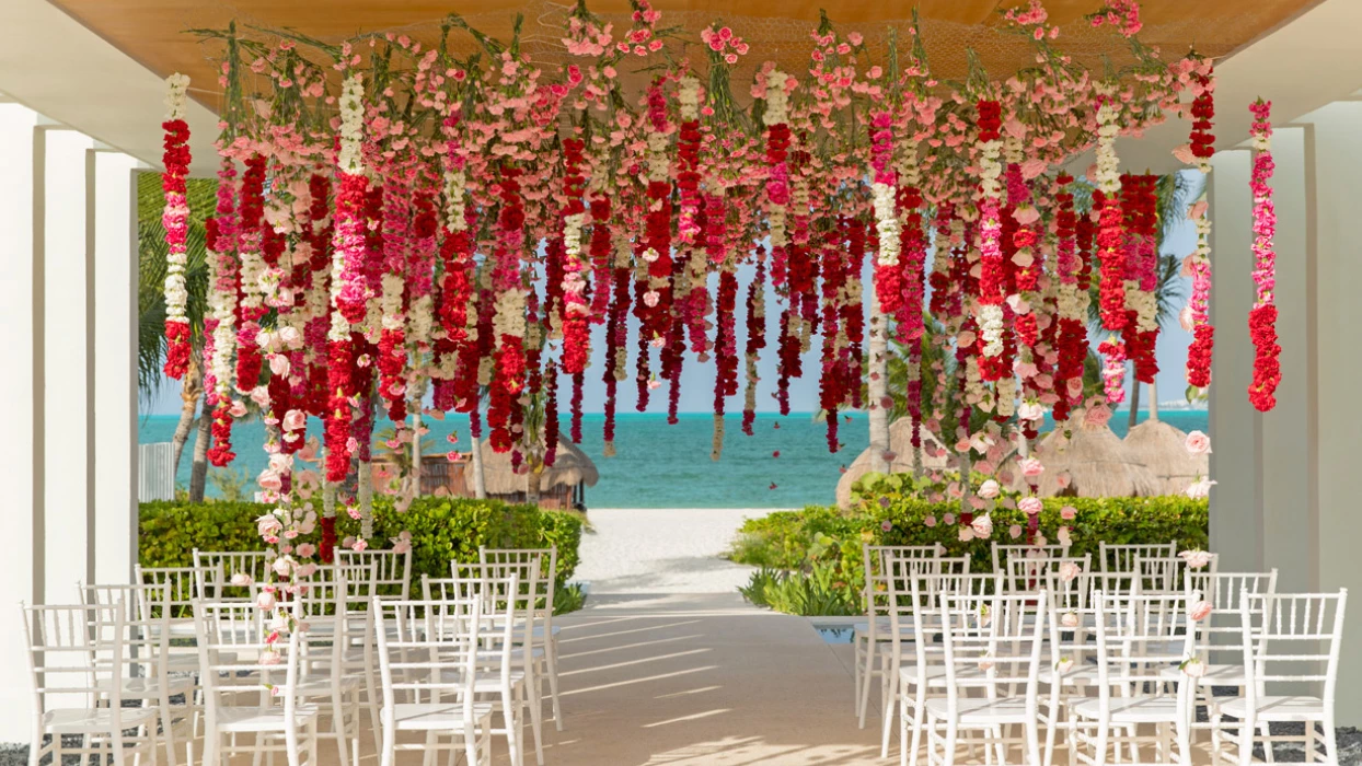 Finest Playa Mujeres gazebo wedding venue facing beach with flowers