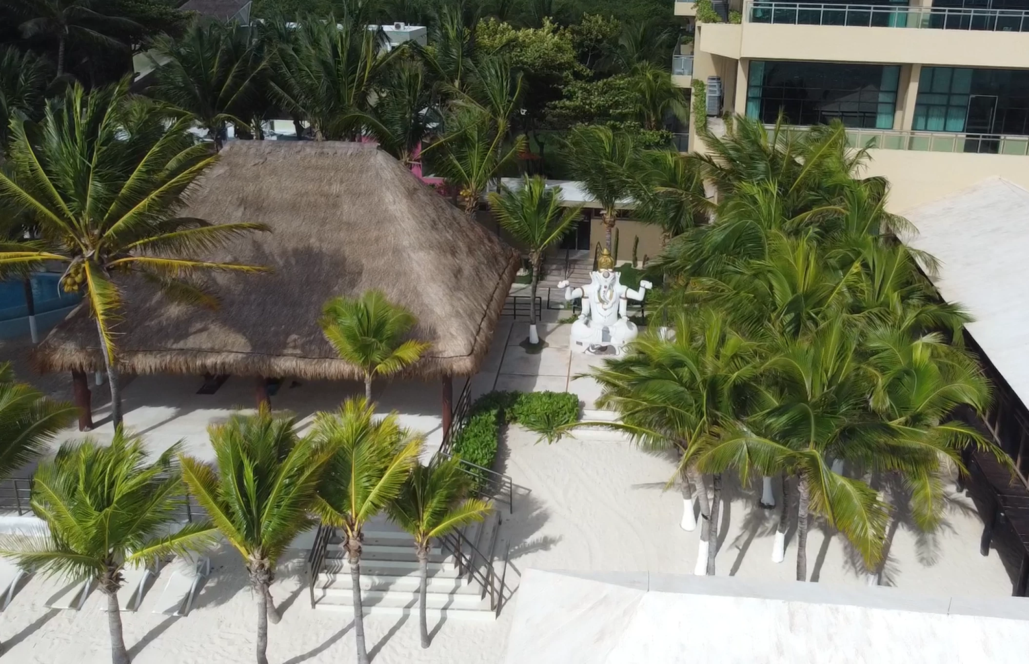 beach reception venue with palm trees at Generations Riviera Maya resort