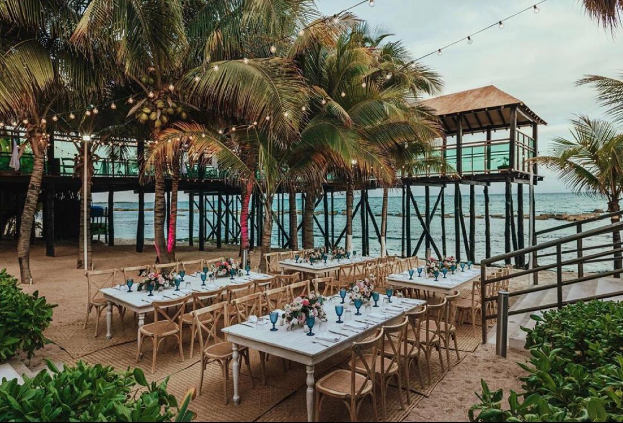 beach reception venue with palm trees at Generations Riviera Maya resort