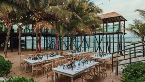 beach reception venue with palm trees at Generations Riviera Maya resort