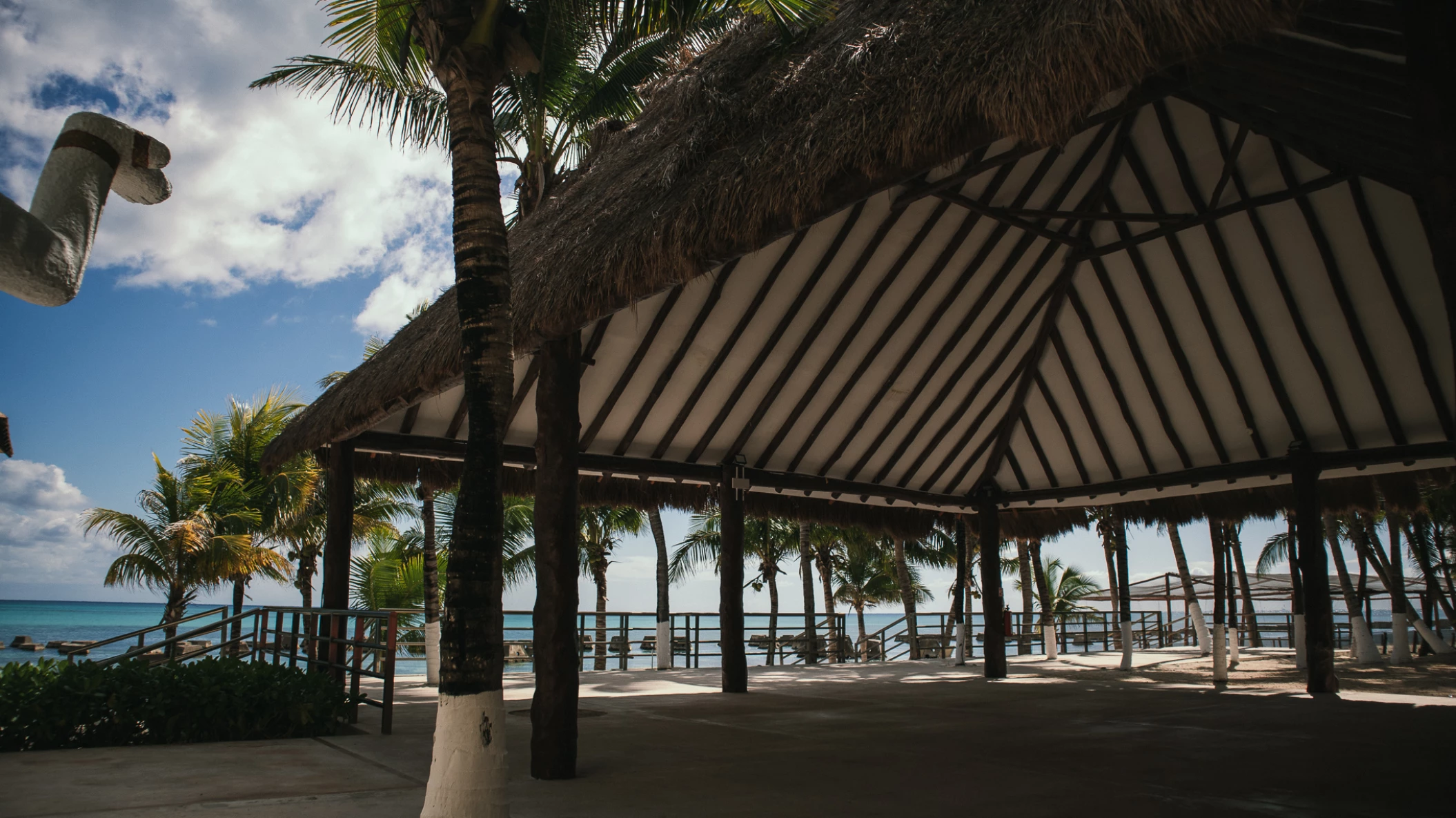 beach reception venue with palm trees at Generations Riviera Maya resort