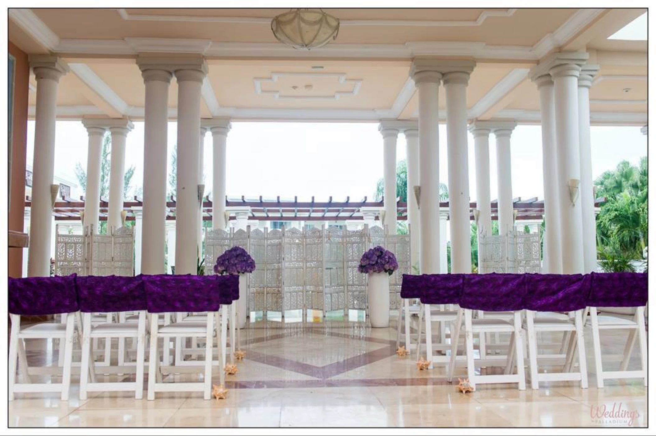 Ceremony in the angesl atrium at GRAND PALLADIUM LADY HAMILTON RESORT & SPA