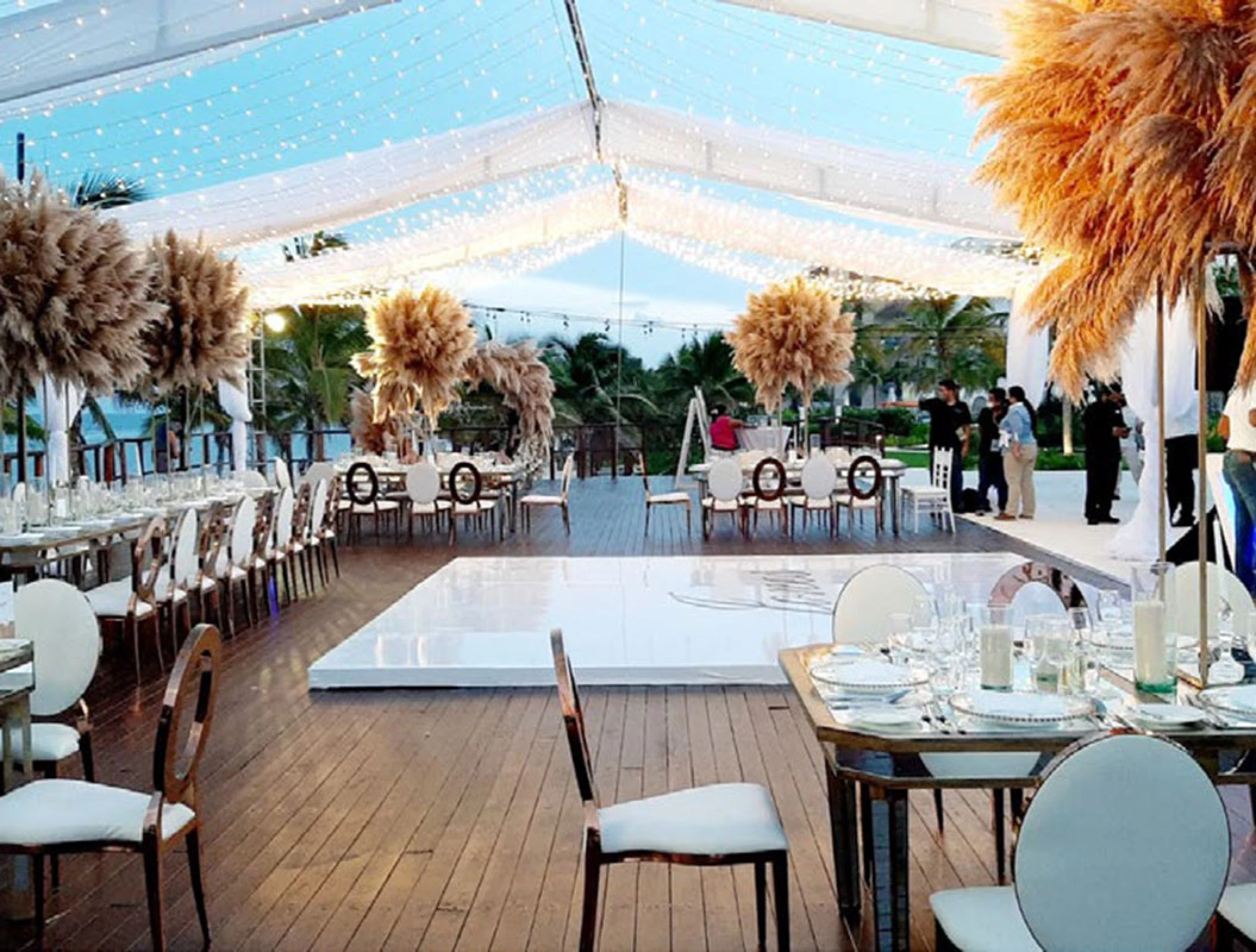 Reception setup at Vora Deck wedding venue at Haven Riviera Cancun Resort.