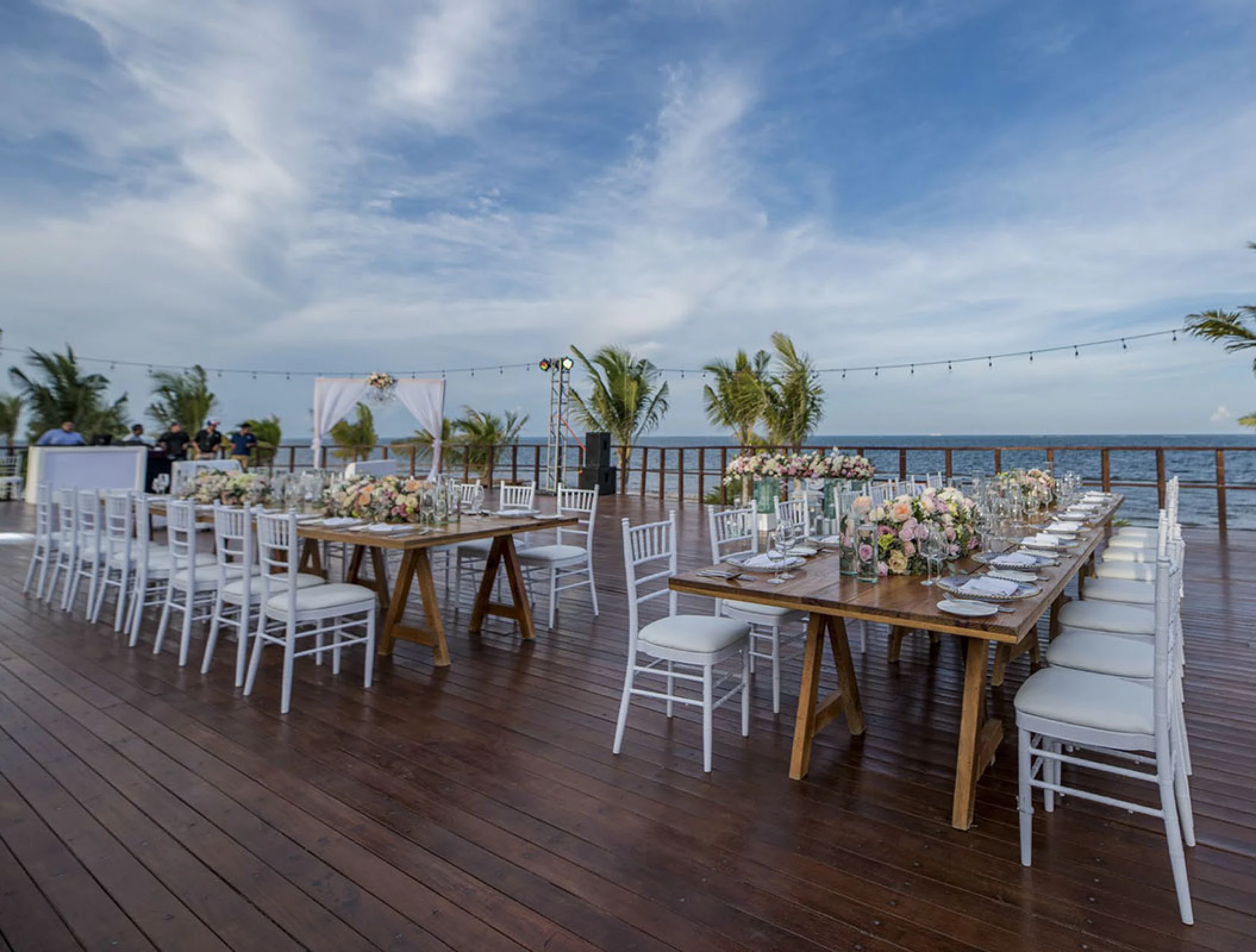 Reception setup at Vora Deck wedding venue at Haven Riviera Cancun Resort.