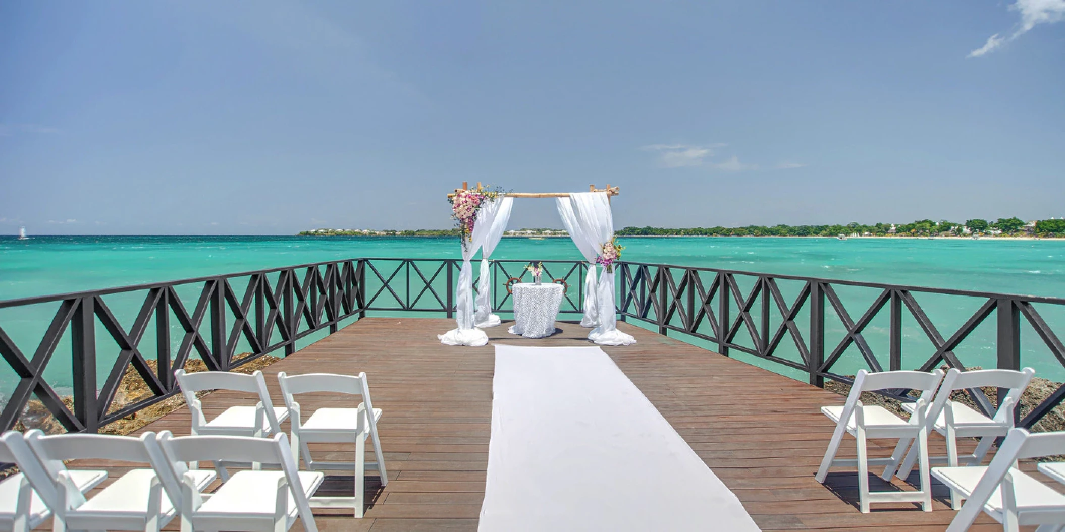 Ceremony decor in the charmin ocean pier at Hideaway at Royalton Negril