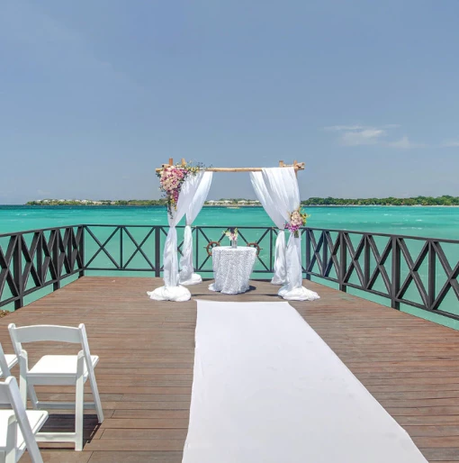 Ceremony decor in the charmin ocean pier at Hideaway at Royalton Negril