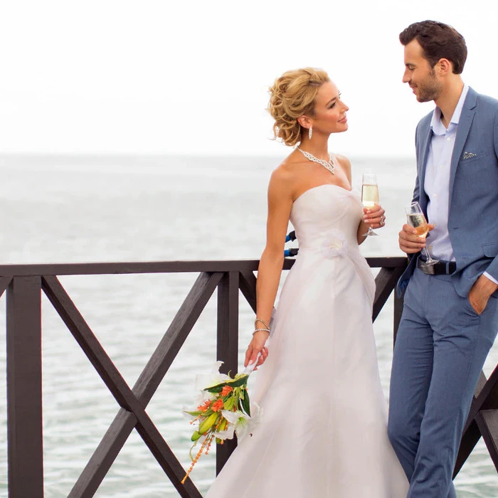 Couple in the charmin ocean pier at Hideaway at Royalton Negril