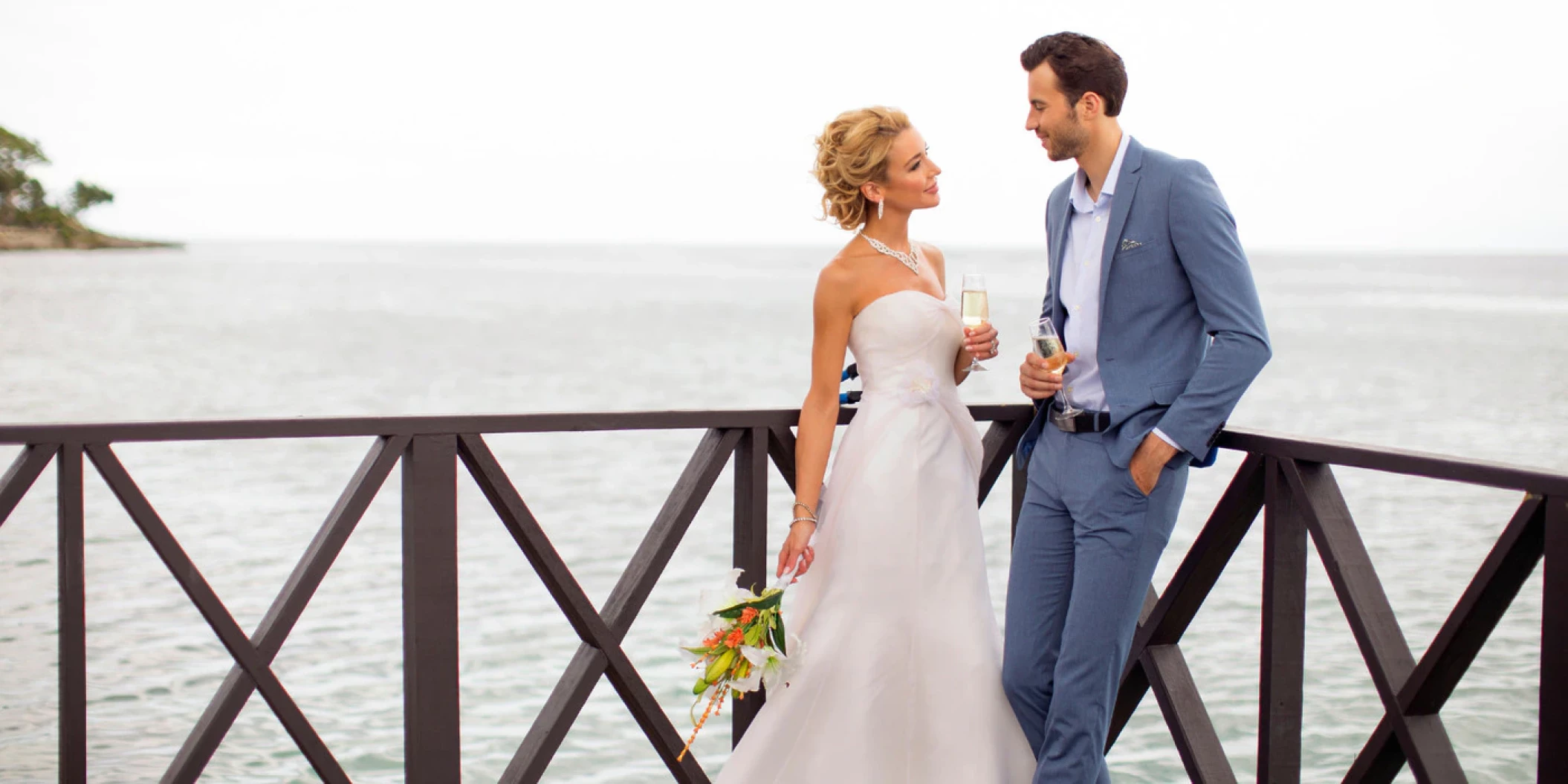 Couple in the charmin ocean pier at Hideaway at Royalton Negril