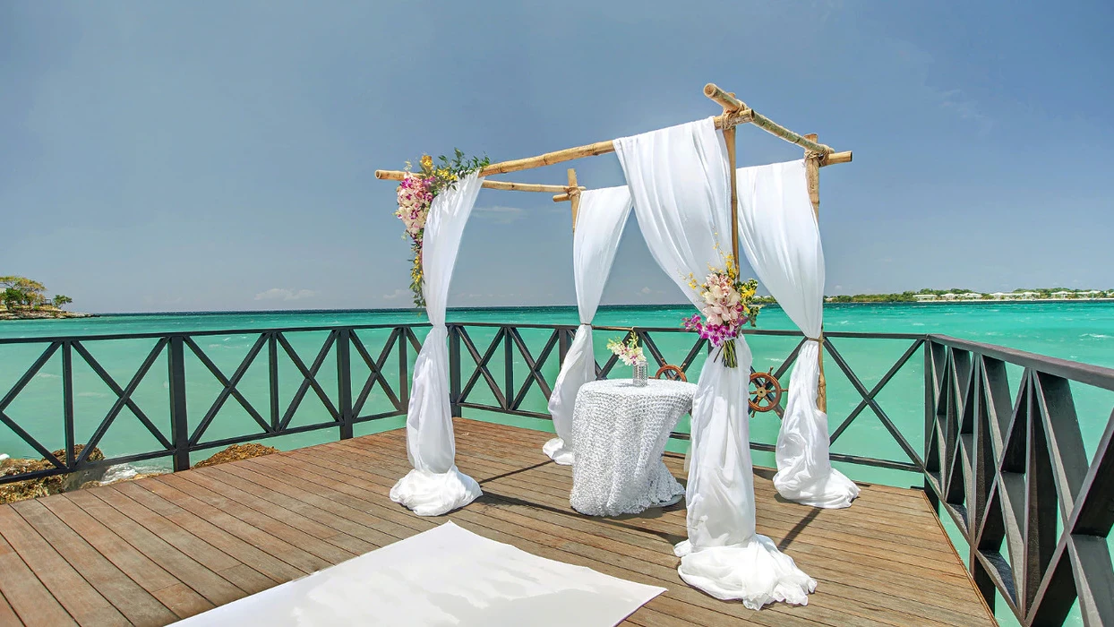 Ceremony decor in the charmin ocean pier at Hideaway at Royalton Negril