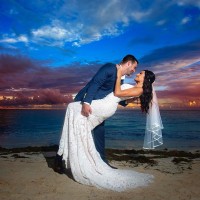 Just married Couple at the beach in Hilton Cancun.