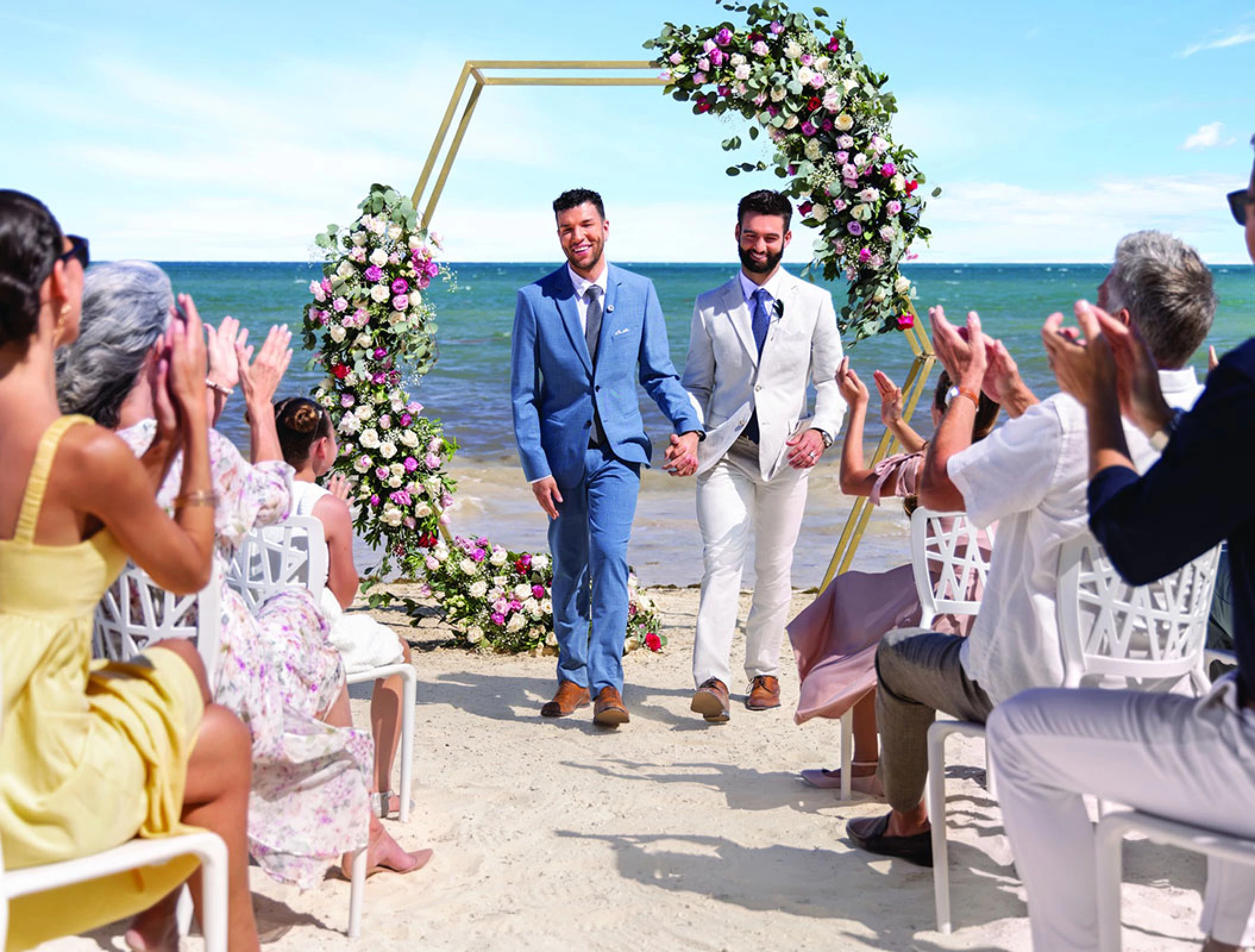 Just married same-sex Couple at the beach in Hilton Cancun.