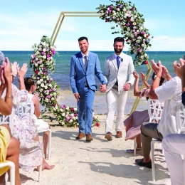 Just married same-sex Couple at the beach in Hilton Cancun.