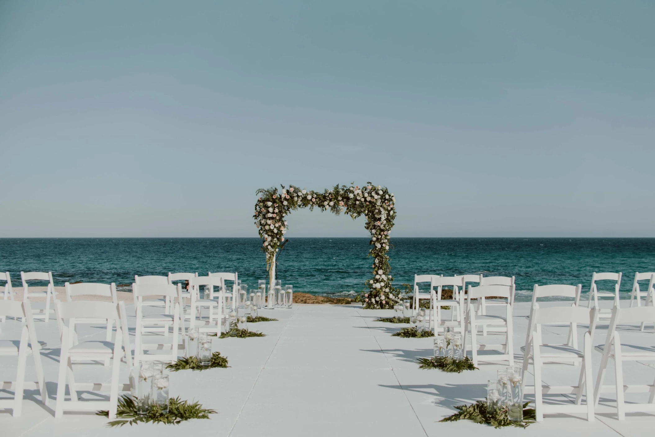 Ceremony decor on the beach wedding venue at Hilton Los Cabos Beach and Golf