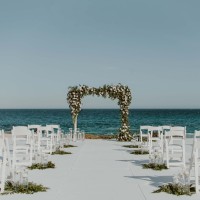 Ceremony decor on the beach wedding venue at Hilton Los Cabos Beach and Golf