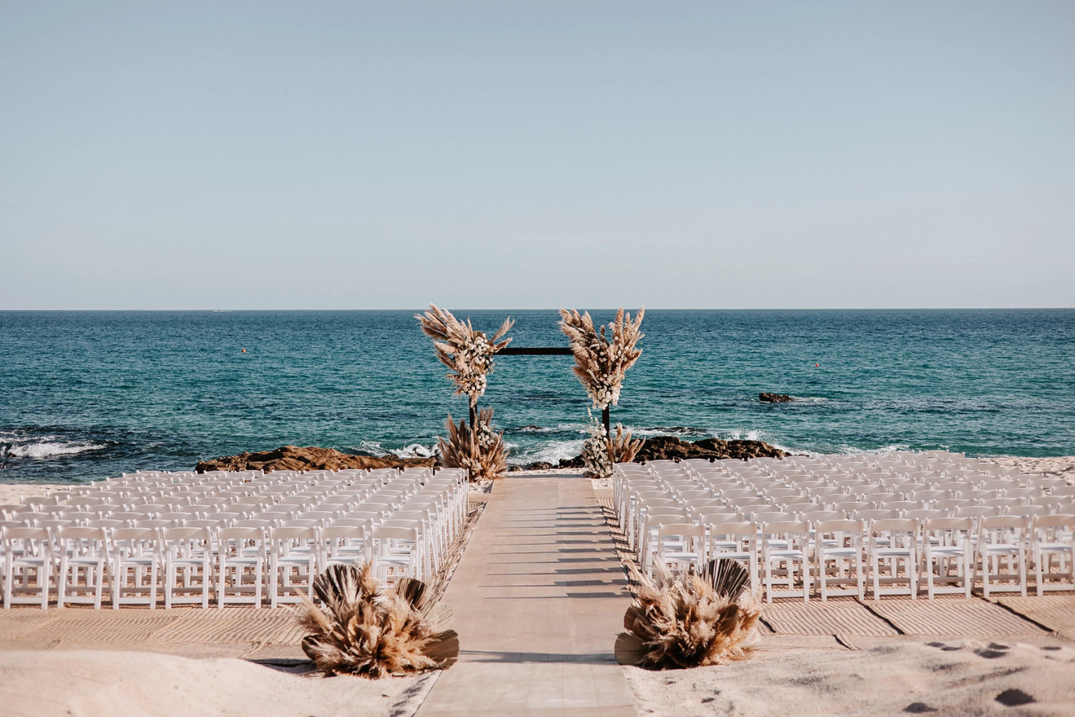 Ceremony decor on the beach at Hilton Los Cabos Beach and Golf