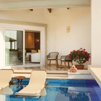 Hilton Playa del Carmen swim up suite with lounge chairs