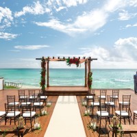 oceanfront wedding venue deck, chairs and altar at Hilton Playa del Carmen