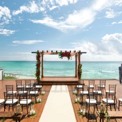 oceanfront wedding venue deck, chairs and altar at Hilton Playa del Carmen