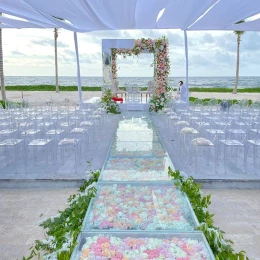 Hilton Tulum's beach venue wedding ceremony setup.