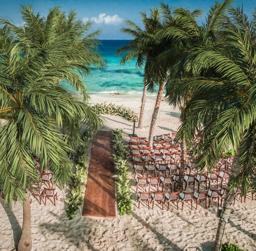 beach wedding venue with chairs at Hotel Xcaret Mexico