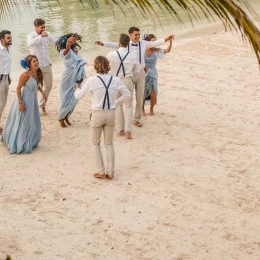 Hotel Xcaret wedding beach party with guests and couples dancing