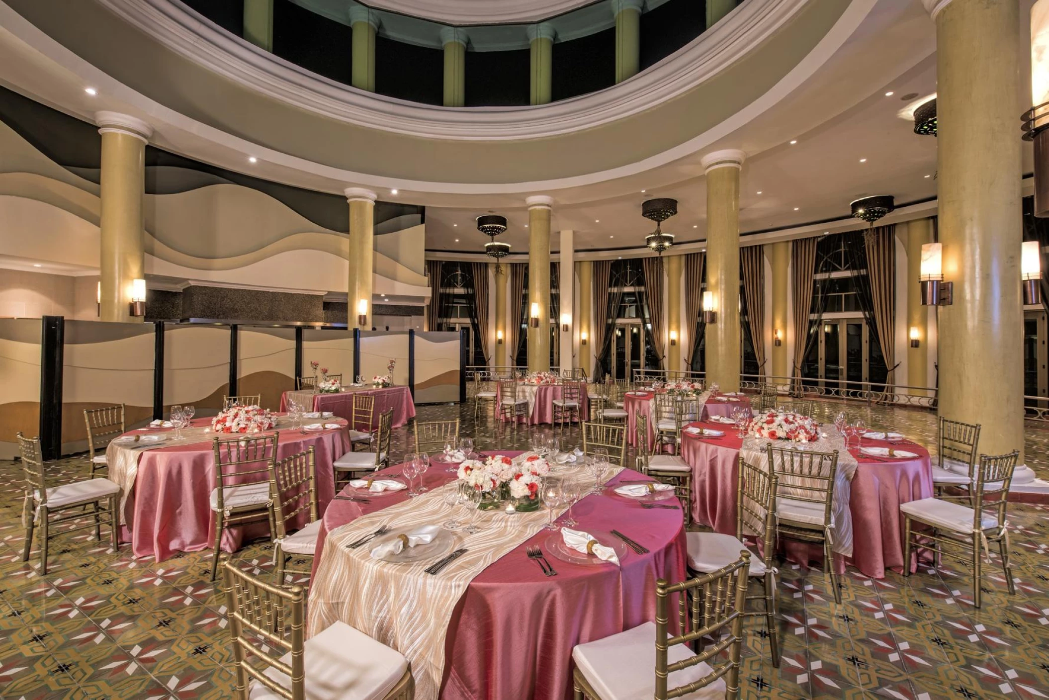 Iberostar Grand Paraiso balroom wedding reception area with tables and chairs