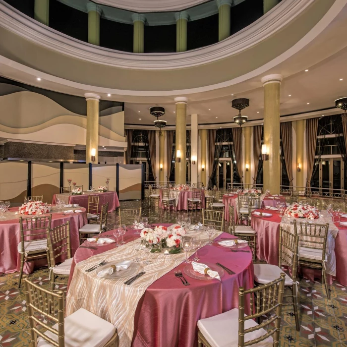 Iberostar Grand Paraiso balroom wedding reception area with tables and chairs