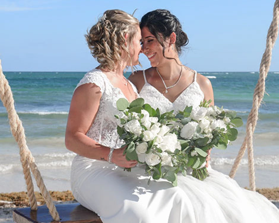 same sex couple enjoying at the beach