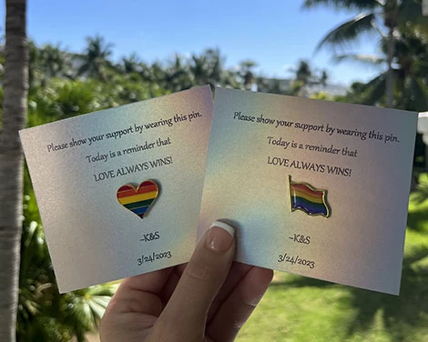 lgtb love pin wearied by guests on same sex wedding