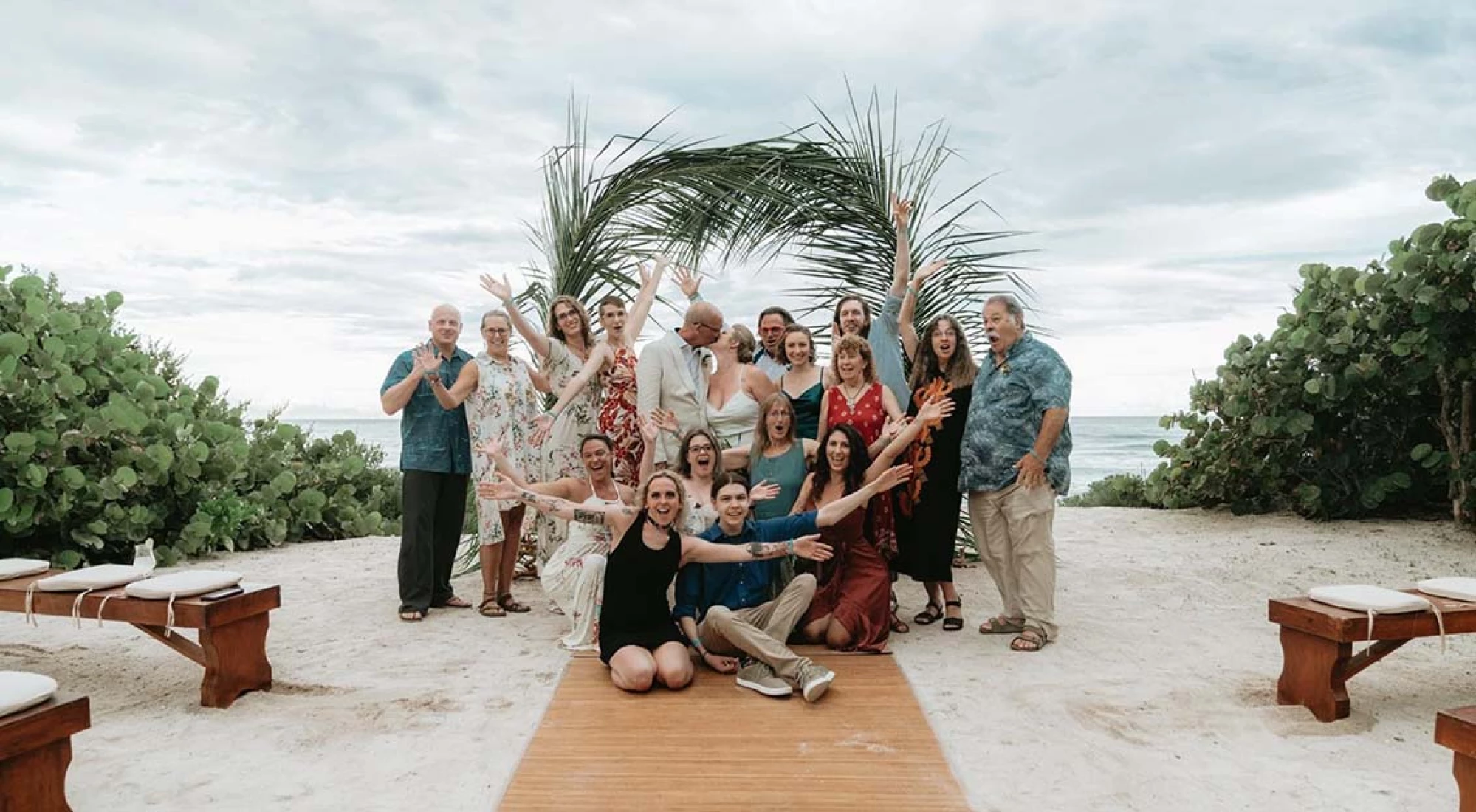 wedding group celebrating newlyweds