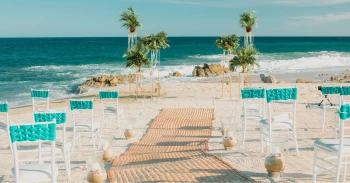 Ceremony decor on the beach at Mar del Cabo by Velas Resort