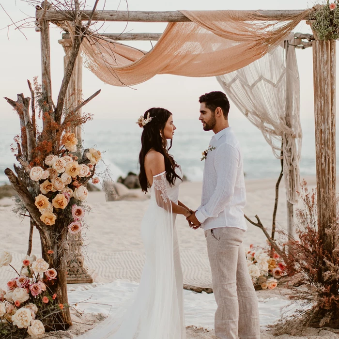 Couple on the beach at Mar del Cabo by Velas Resort