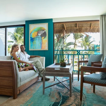 Couple at Margaritaville Island Reserve Riviera Cancun master suite.
