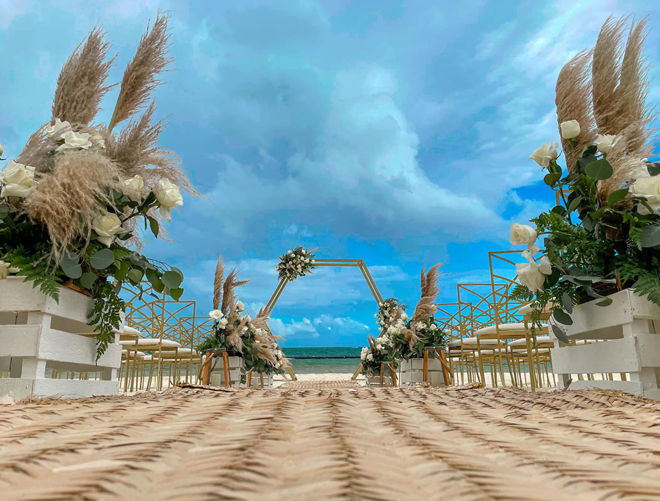 Ceremony decor in beach venue at Margaritaville Island Reserve Riviera Cancun.