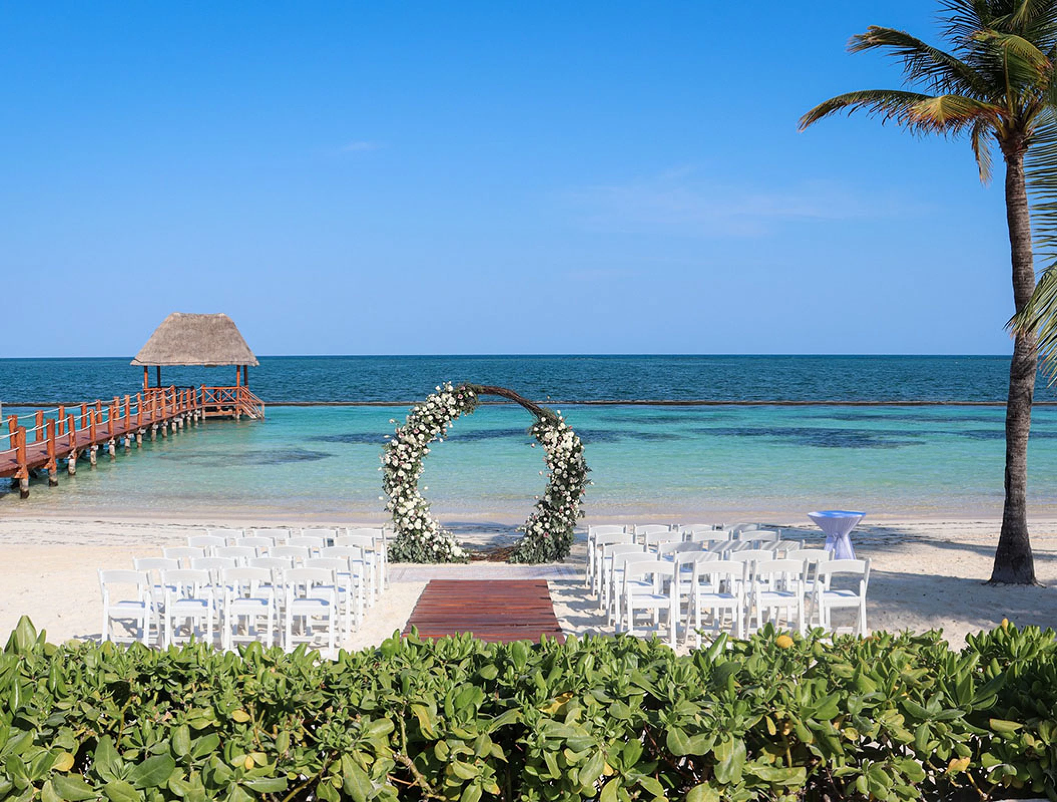 Ceremony decor in beach venue at Margaritaville Island Reserve Riviera Cancun.