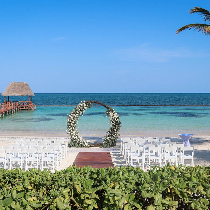 Ceremony decor in beach venue at Margaritaville Island Reserve Riviera Cancun.