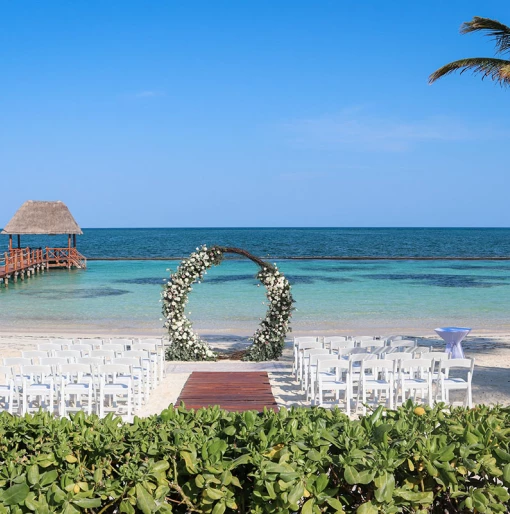 Ceremony decor in beach venue at Margaritaville Island Reserve Riviera Cancun.