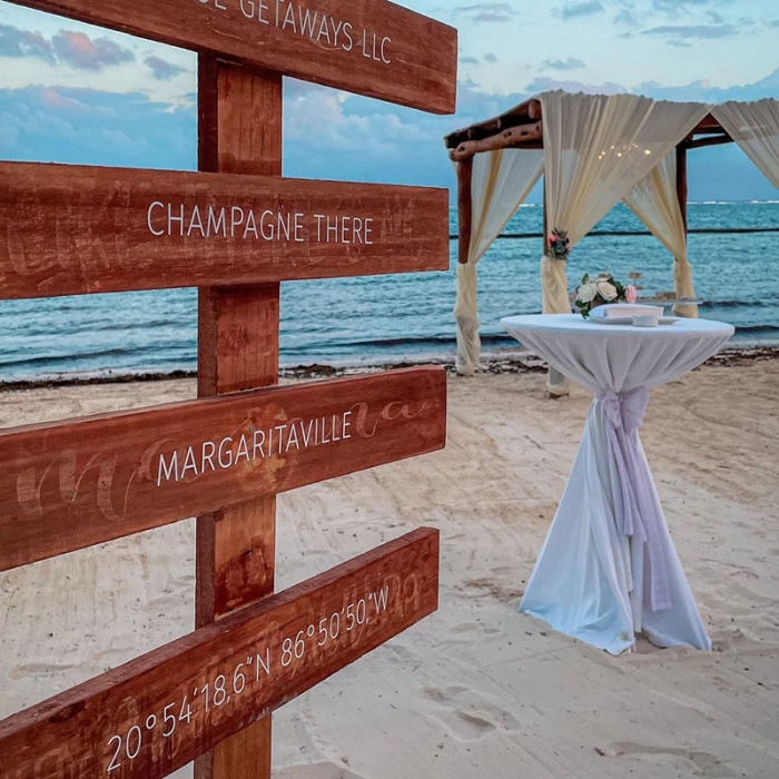 Ceremony decor in beach venue at Margaritaville Island Reserve Riviera Cancun.