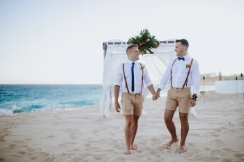 Gay couple on their ceremony at the Marquis Los Cabos beach