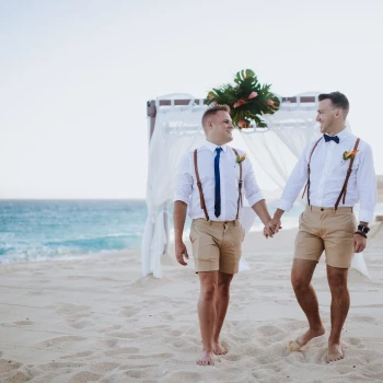 Gay couple on their ceremony at the Marquis Los Cabos beach