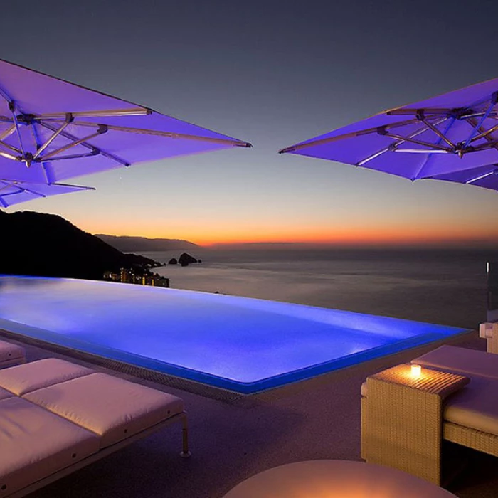 Night shot of Rooftop North pool at Hotel Mousai Puerto Vallarta.